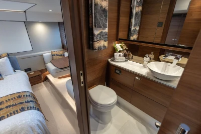 Luxurious 2020 Princess F55 yacht interior with elegant bedroom and modern bathroom design.