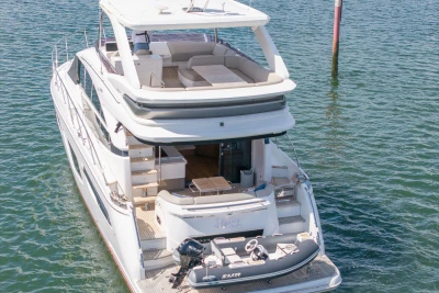 Luxury 2020 Princess F55 yacht with spacious deck and tender boat on water.