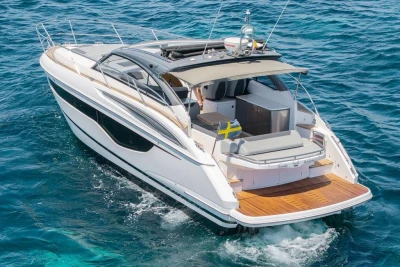 2018 Princess V40 yacht cruising on clear blue ocean waters.