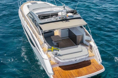 Luxurious 2018 Princess V40 yacht cruising on open sea, featuring spacious deck.