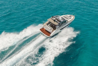 2018 Princess V40 yacht cruising on clear blue ocean waters.