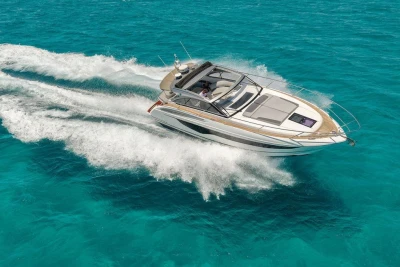 2018 Princess V40 yacht cruising on clear turquoise waters.