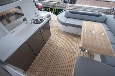Luxurious 2018 Princess V40 yacht interior with sleek seating and elegant wooden flooring.