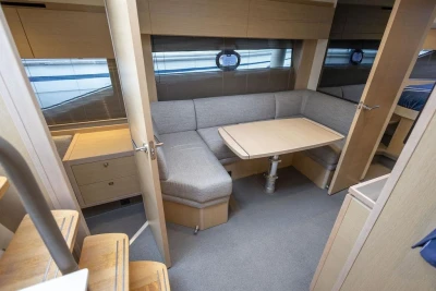 Interior of 2018 Princess V40 yacht with cozy seating and dining area.