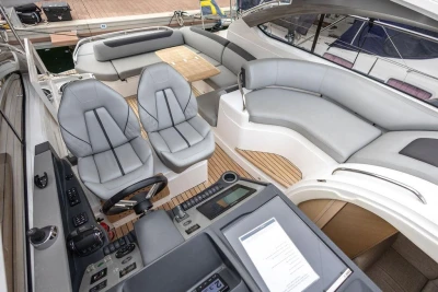Luxurious 2018 Princess V40 yacht interior with sleek seating and modern controls.
