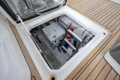 Engine compartment of a 2018 Princess V40 yacht, featuring equipment and storage.