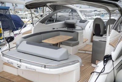 Luxurious 2018 Princess V40 yacht interior with elegant seating and wooden accents.