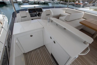 Upper deck of the Princess 68 with seating area and helm.