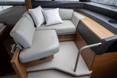 Interior of the 2016 Princess 68 yacht with gray upholstery.