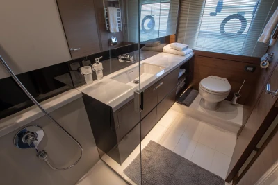 Bathroom on a Princess 68 yacht, modern design with shower, sink, and toilet.