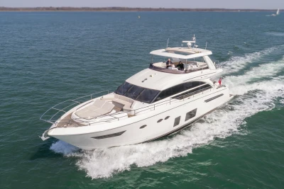 2016 Princess 68 luxury yacht cruising on the water.