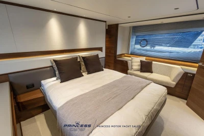 Luxurious bedroom interior of 2026 Princess S65 yacht with modern design and elegant furnishings.