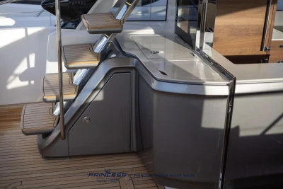 Luxurious interior of 2026 Princess S65 yacht with sleek stairs and modern design.