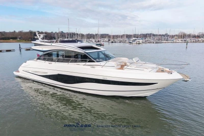 2026 Princess S65 yacht on calm water, showcasing sleek design and luxury features.
