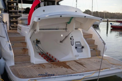Luxury yacht Princess S65, 2026 model, featuring a spacious rear deck and storage area.