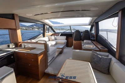 Luxurious 2019 Princess S60 yacht interior with elegant seating and panoramic ocean views.