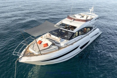 Luxurious 2019 Princess S60 yacht cruising on open water, featuring sleek design and spacious deck.