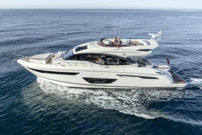 2019 Princess S60 yacht cruising on open water, side view.