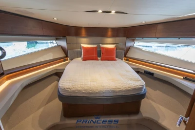 Luxurious 2019 Princess S60 yacht bedroom with modern design and elegant furnishings.