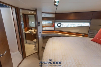 Luxurious 2019 Princess S60 yacht interior with elegant bedroom and ensuite bathroom.