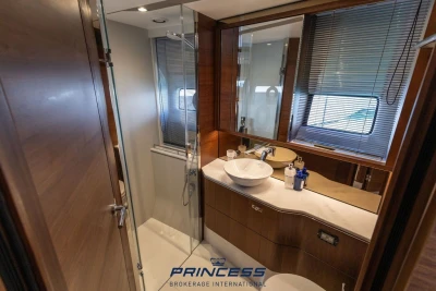 Luxurious bathroom interior of 2019 Princess S60 yacht with modern fixtures and wooden accents.
