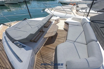 Luxurious 2019 Princess S60 yacht deck with elegant seating and sunbed.