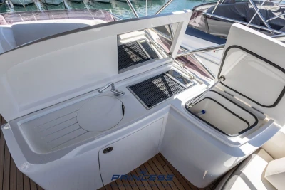 Outdoor kitchen on 2019 Princess S60 yacht with sink and grill.