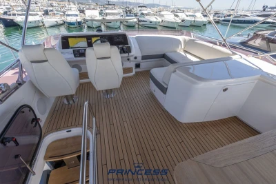 Luxurious 2019 Princess S60 yacht interior with elegant seating and modern helm station.