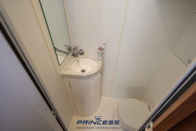 Compact bathroom in 2019 Princess S60 yacht with sink, mirror, and toilet.
