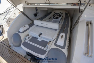 Inflatable boat stored in 2019 Princess S60 yacht's compartment.