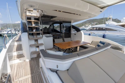 Luxurious 2018 Princess S60 yacht with elegant seating and dining area on deck.