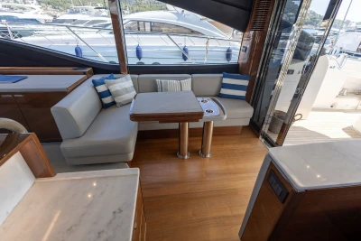 Luxurious interior of 2018 Princess S60 yacht with elegant seating and table.