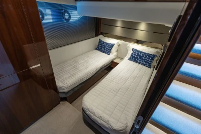 Luxurious twin cabin interior of 2018 Princess S60 yacht with modern decor.