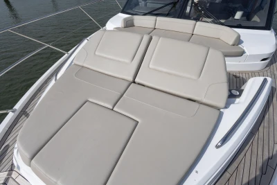 The 2022 Princess F55 features a large, cushioned sun deck on the foredeck.