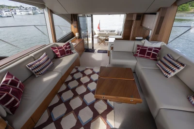 Interior of the Princess F55 yacht with elegant sofas and modern design.