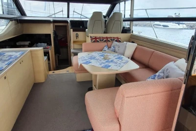 Luxurious 2017 Princess 43 yacht interior with cozy seating and nautical decor.