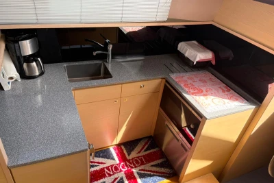 Modern kitchen in a 2017 Princess 43 yacht with sleek countertops and appliances.