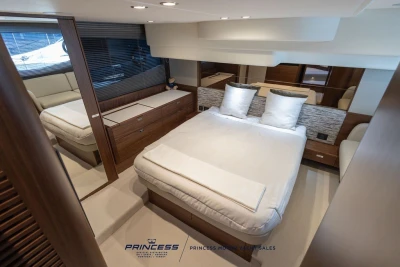 Luxurious bedroom interior of 2025 Princess F50 yacht with modern design and elegant furnishings.