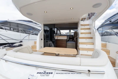 Luxurious 2025 Princess F50 yacht interior with elegant seating and wooden accents.