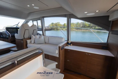 Luxurious interior of 2025 Princess F50 yacht with scenic water view.