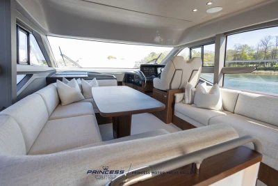 Luxurious interior of 2025 Princess F50 yacht with elegant seating and panoramic windows.