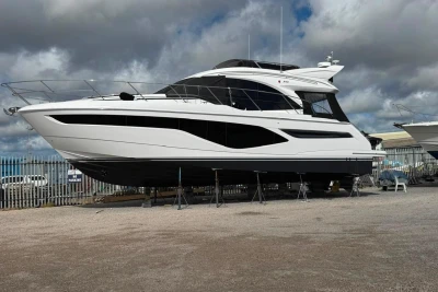 2025 Princess F50 yacht on dry dock under cloudy skies.