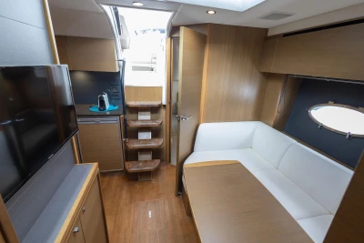 Luxurious interior of 2014 Princess V39 yacht with modern furnishings and wooden accents.