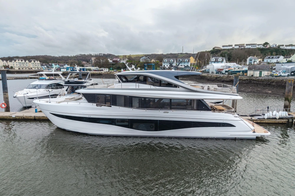 Luxurious 2026 Princess X80 yacht docked in a scenic marina setting.