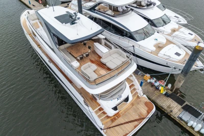 Luxury 2026 Princess X80 yacht docked, showcasing elegant design and spacious deck layout.