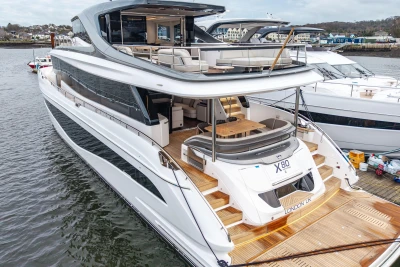 Luxurious 2026 Princess X80 yacht docked, showcasing sleek design and spacious decks.