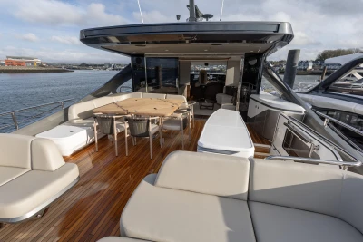 Luxurious 2026 Princess X80 yacht deck with elegant seating and dining area.