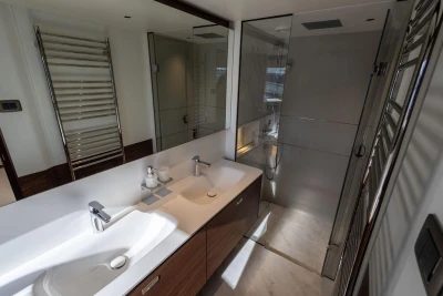 Luxurious bathroom in 2026 Princess X80 yacht with dual sinks and modern shower.