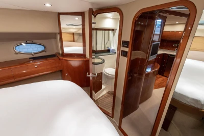Luxurious interior of 2007 Princess V48 yacht featuring elegant wood finishes and modern amenities.